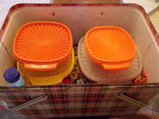 tupperware containers in vintage metal cooler