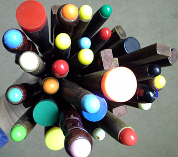 bundle of fondue forks with coloured ends showing