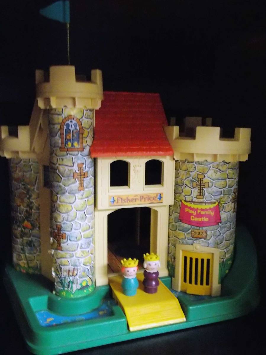vintage fisher price castle with Queen and Princess standing on the drawbridge