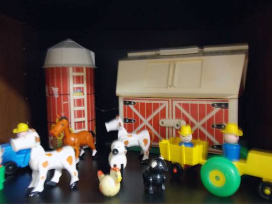 Vintage Fisher Price farm with animals, silo, and farmer driving tractor
