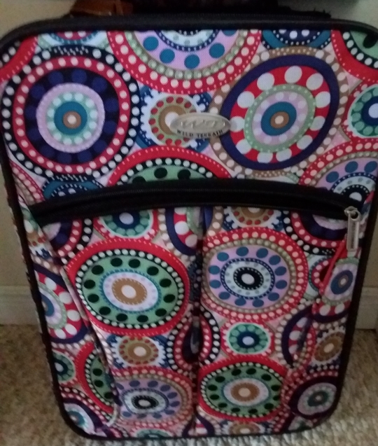 colourful, polka dot-patterned suitcase